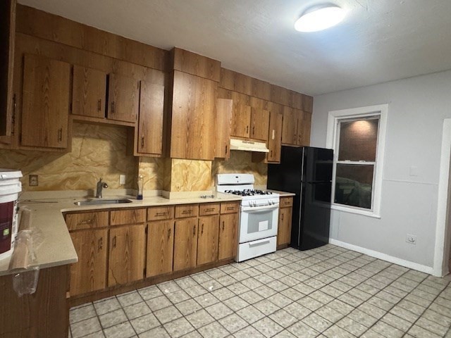 166 A Chelsea Street, Unit 1 Boston, MA 02128 - Photo 3 of 13 a kitchen with stainless steel appliances granite countertop a sink stove and refrigerator