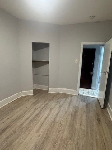 166 A Chelsea Street, Unit 1 Boston, MA 02128 - Photo 5 of 13 a view of an empty room with wooden floor and closet