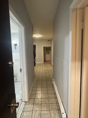 166 A Chelsea Street, Unit 1 Boston, MA 02128 - Photo 6 of 13 a view of a hallway with wooden floor