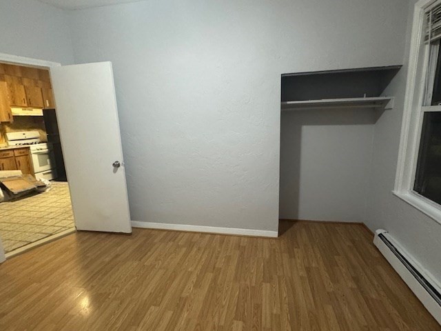 166 A Chelsea Street, Unit 1 Boston, MA 02128 - Photo 10 of 13 a view of an empty room with wooden floor and a window