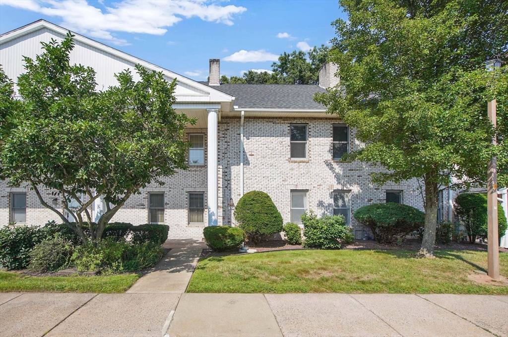 9 Castle Hills Road, Unit F Agawam, MA 01001 - Photo 1 of 42 a front view of a house with a garden