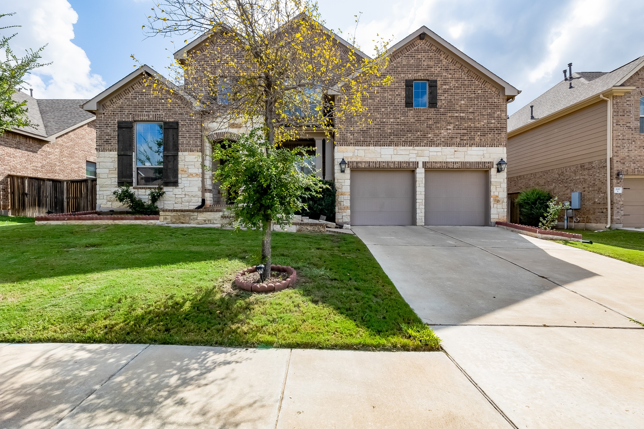 204 Lady Bird Lane Georgetown, TX 78628 - Photo 1 of 40 a front view of a house with a yard and potted plants