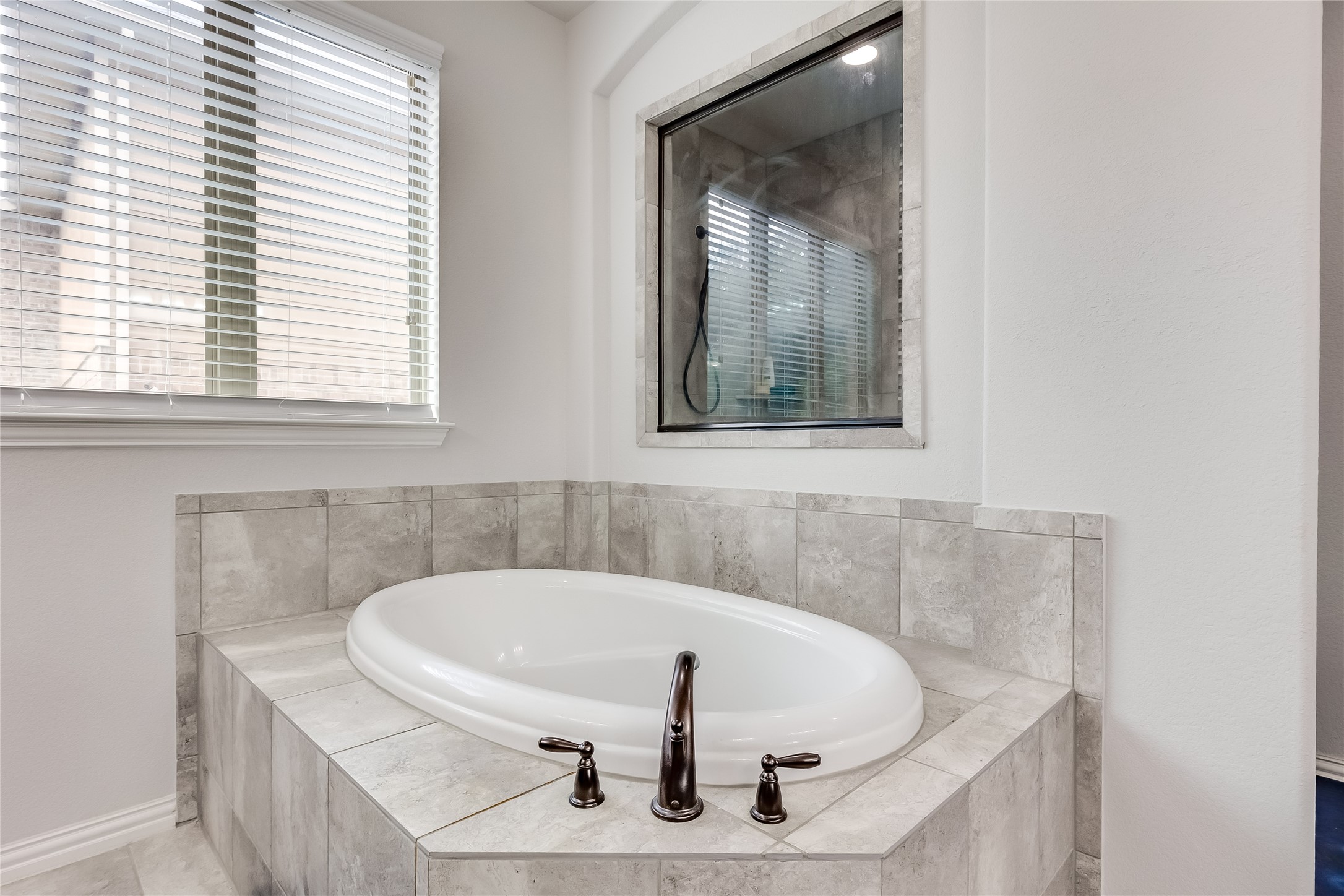 204 Lady Bird Lane Georgetown, TX 78628 - Photo 20 of 40 a white bath tub sitting in a bathroom
