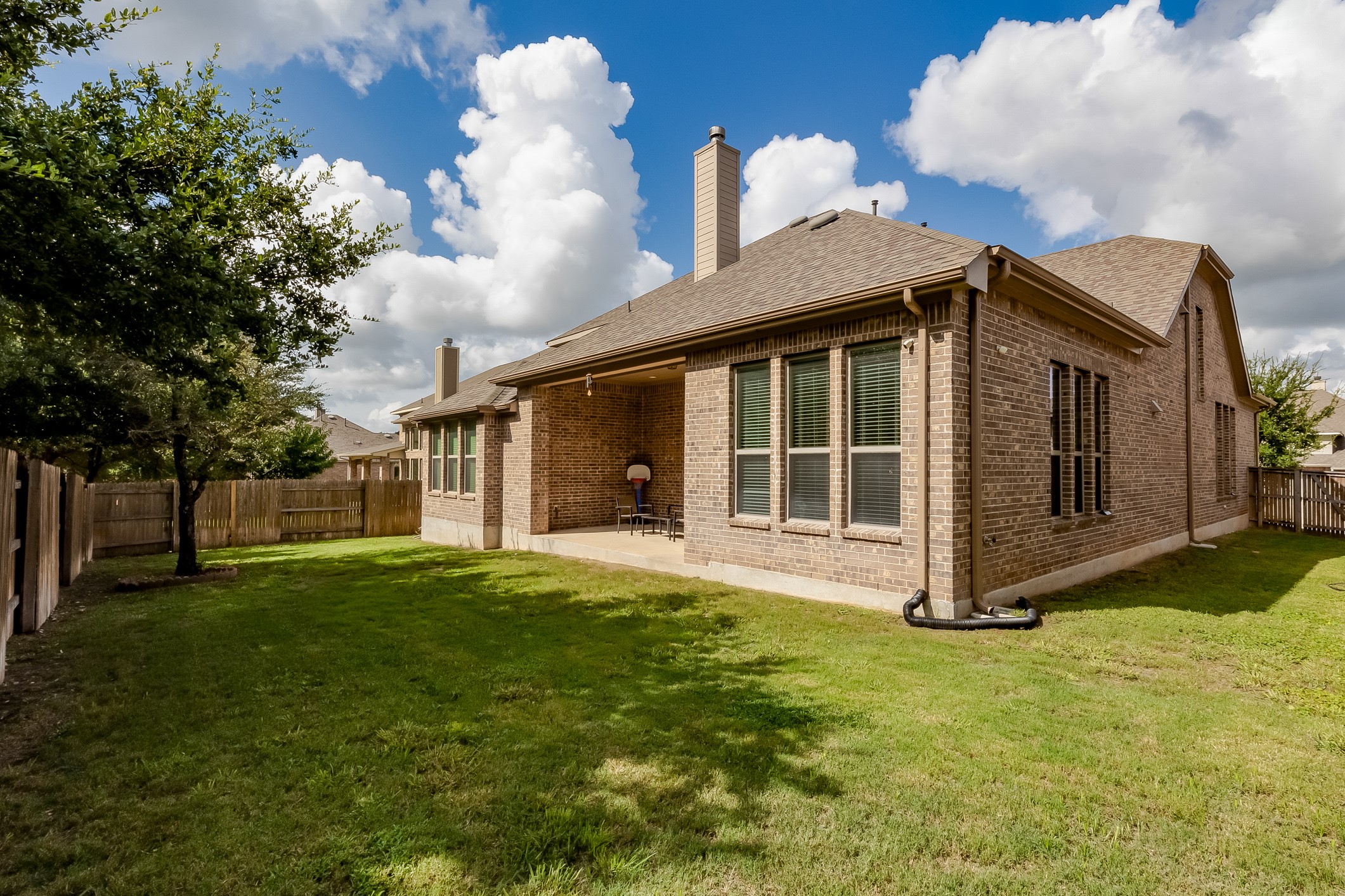 204 Lady Bird Lane Georgetown, TX 78628 - Photo 35 of 40 a view of a house with a yard and large trees