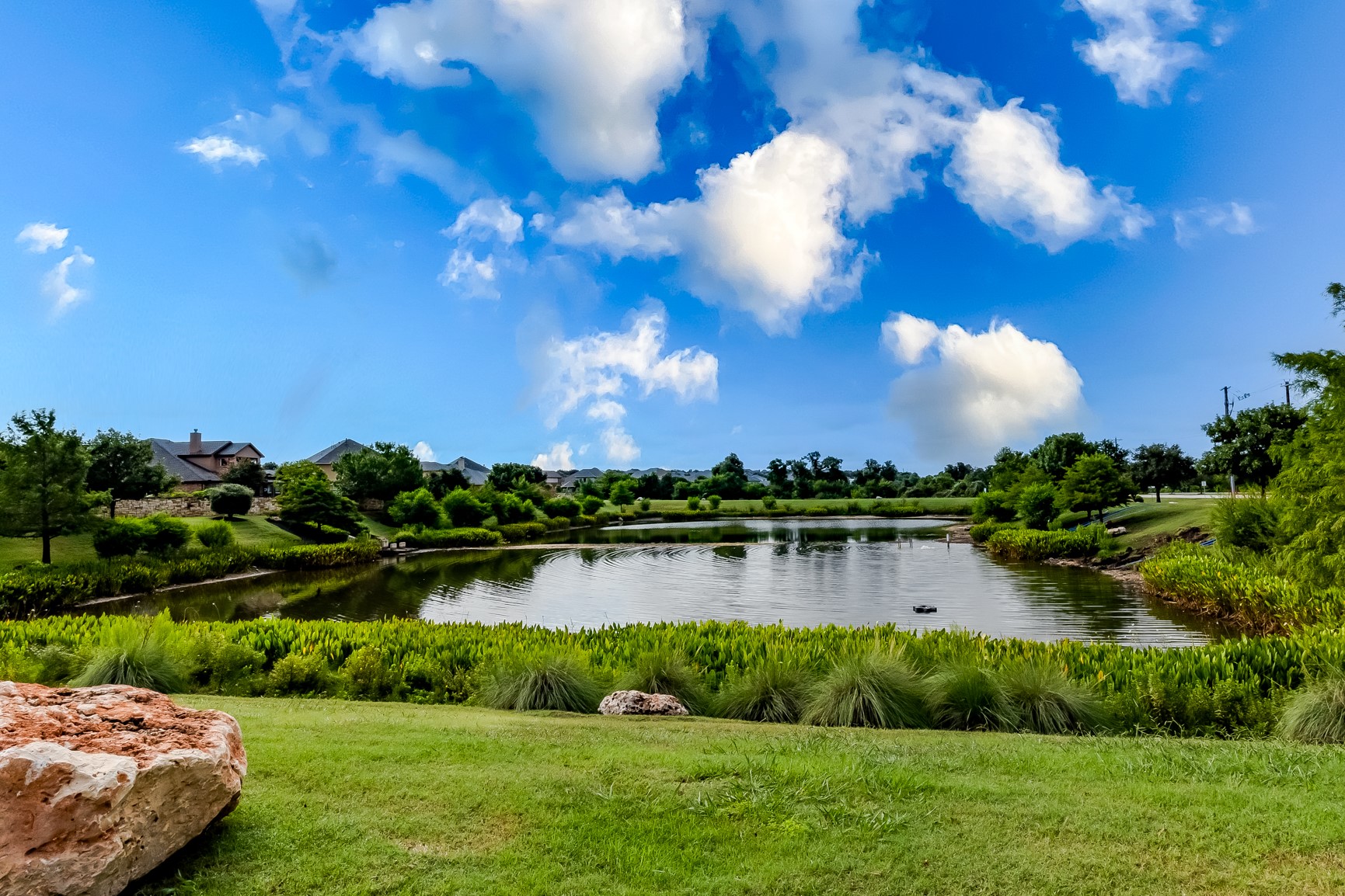 204 Lady Bird Lane Georgetown, TX 78628 - Photo 39 of 40 a view of a lake with houses in the back