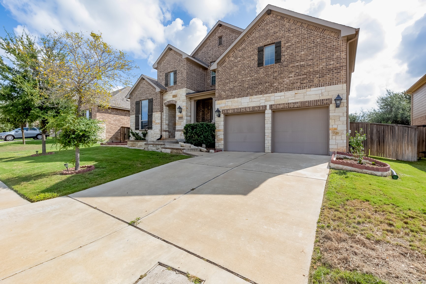 204 Lady Bird Lane Georgetown, TX 78628 - Photo 4 of 40 a front view of a house with a yard and garage
