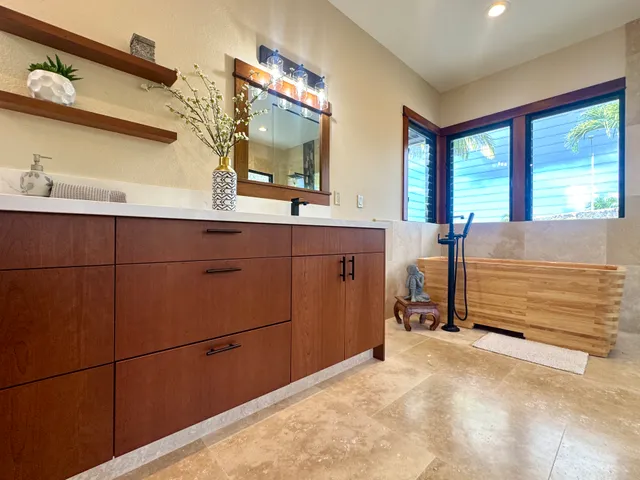 a bathroom with 2 sink and a mirror