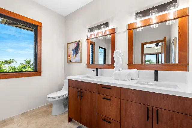 a bedroom with bed and a potted plant