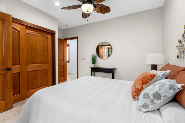 a living room with furniture and a toilet
