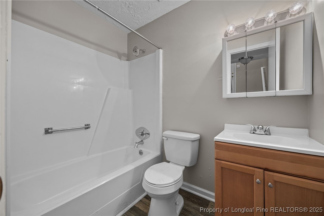 735 Ashbrook Road Fayetteville, NC 28314 - Photo 11 of 39 a bathroom with a sink toilet and shower