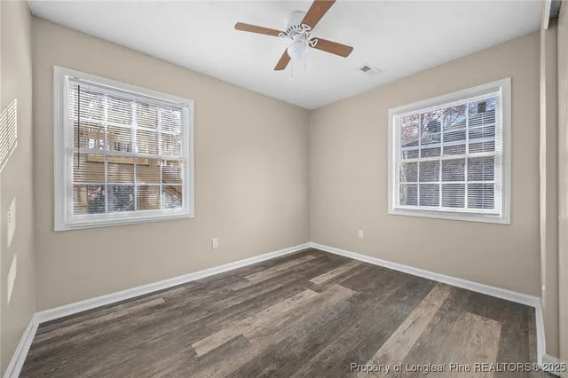 a view of empty room with windows