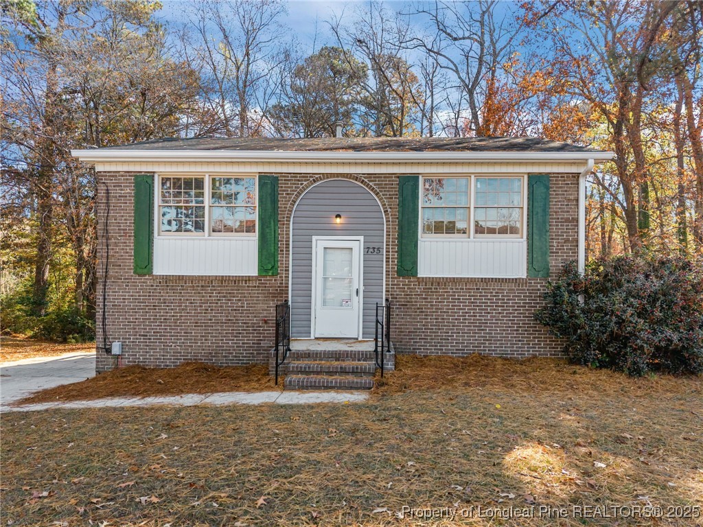 735 Ashbrook Road Fayetteville, NC 28314 - Photo 2 of 39 front view of a house with a yard