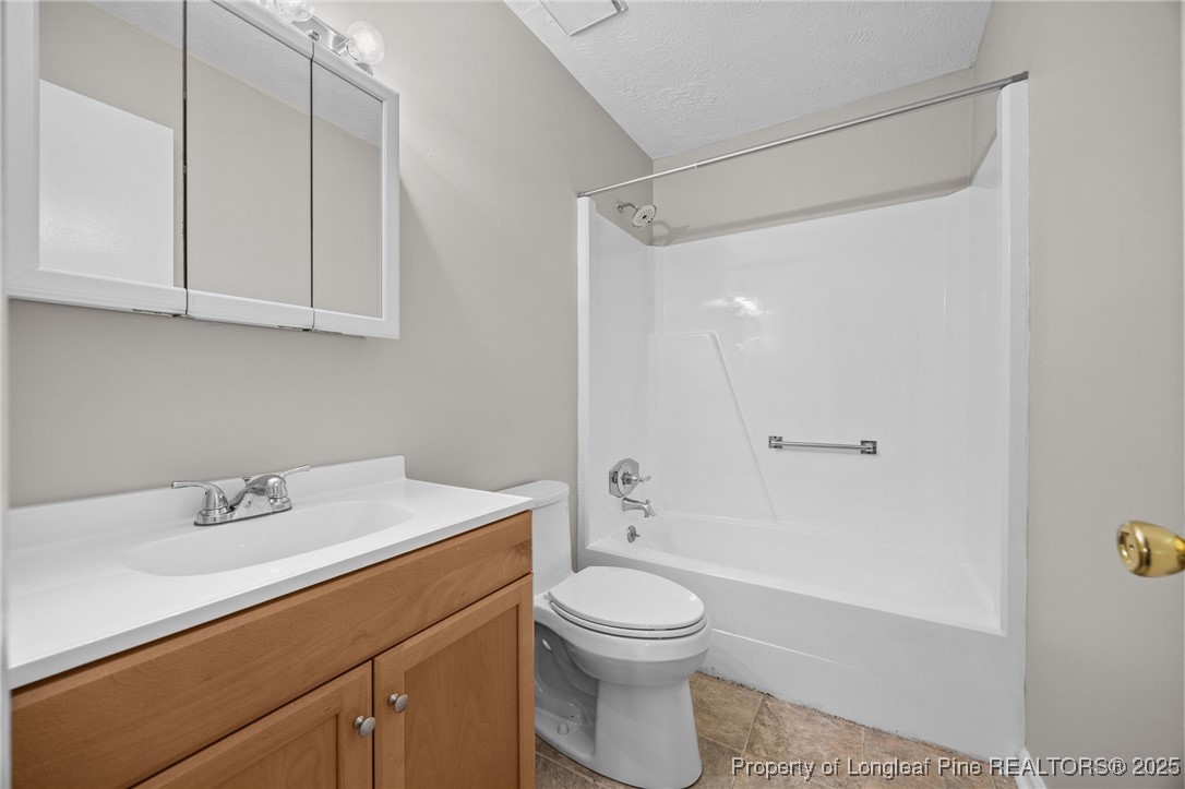 735 Ashbrook Road Fayetteville, NC 28314 - Photo 21 of 39 a bathroom with a sink a toilet and shower