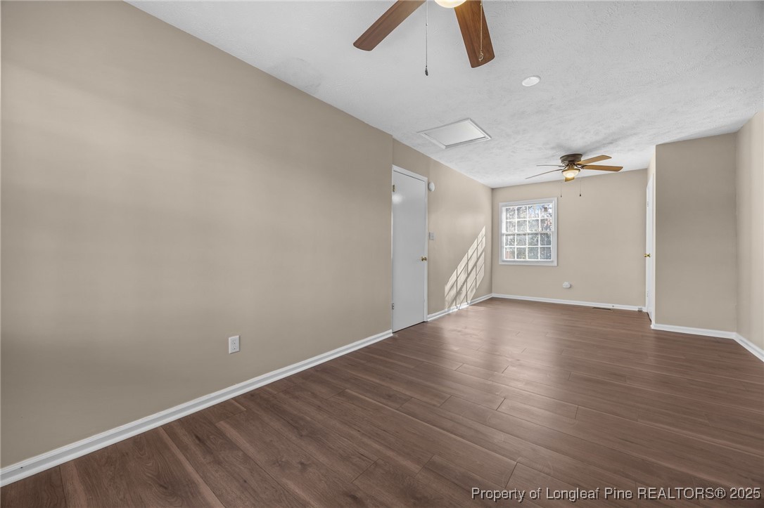 735 Ashbrook Road Fayetteville, NC 28314 - Photo 25 of 39 an empty room with wooden floor and windows