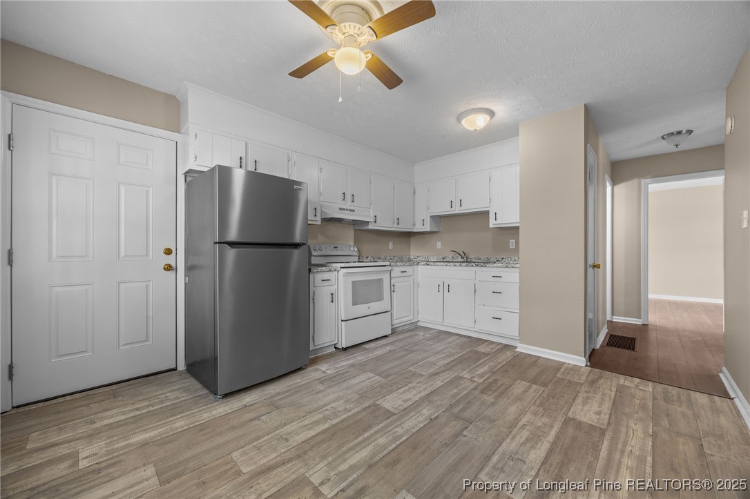 735 Ashbrook Road Fayetteville, NC 28314 - Photo 28 of 39 a kitchen with stainless steel appliances granite countertop a refrigerator and a sink