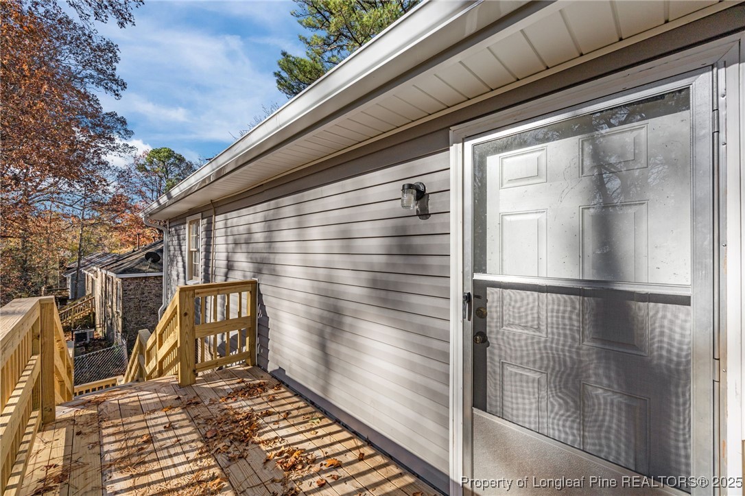 735 Ashbrook Road Fayetteville, NC 28314 - Photo 32 of 39 a view of a door and wooden floor
