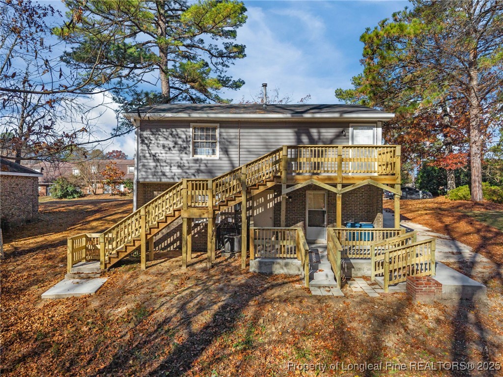 735 Ashbrook Road Fayetteville, NC 28314 - Photo 37 of 39 a view of a building with large trees