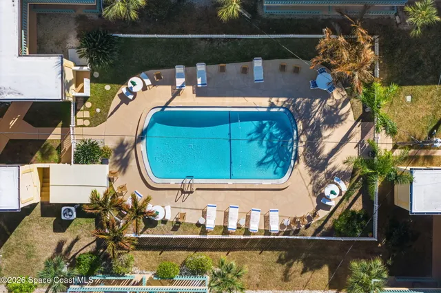 a view of a swimming pool with a lounge chairs