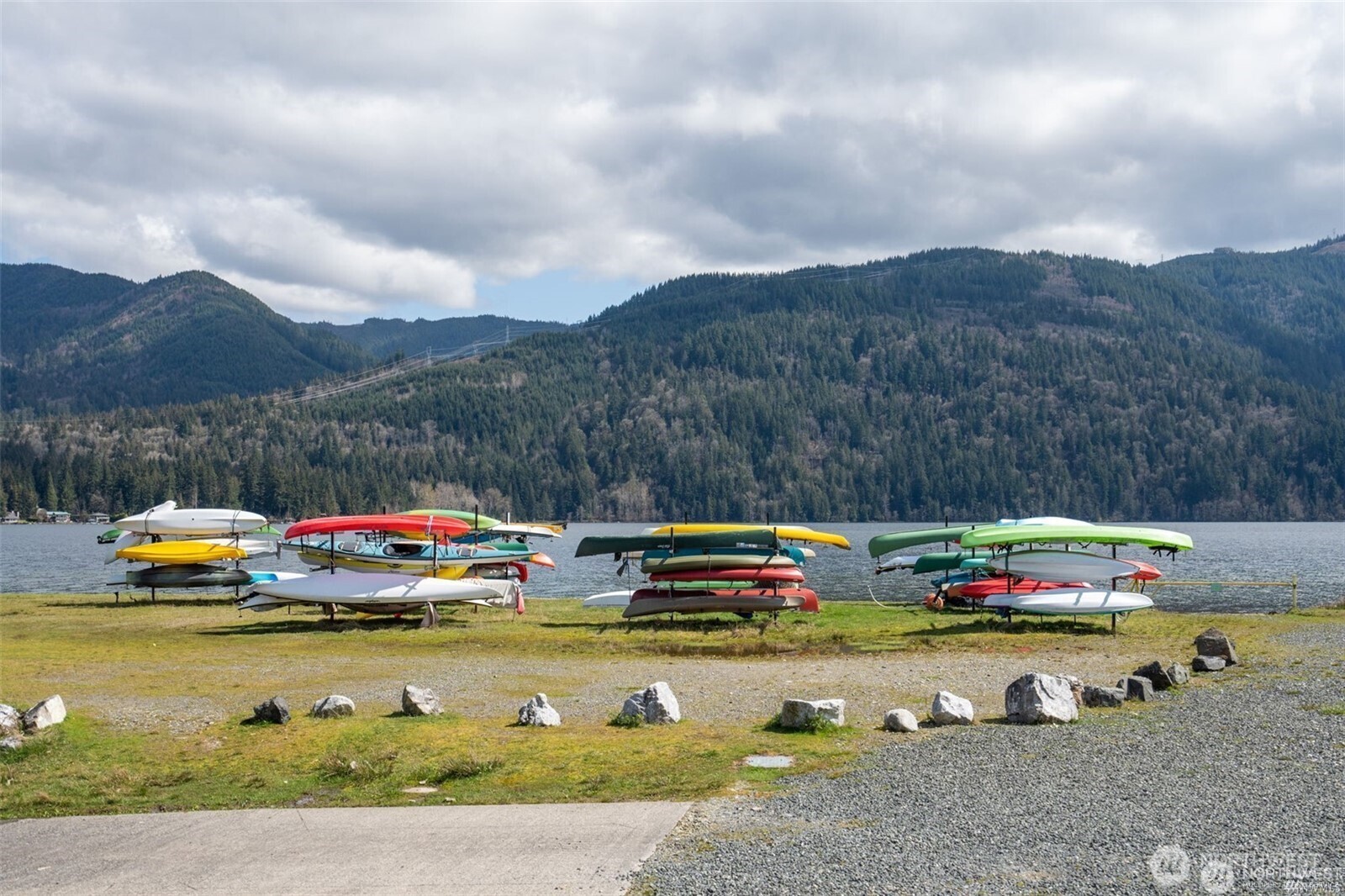 1 Lake Louise Drive, Unit 42 Bellingham, WA 98229 - Photo 21 of 21 a view of swimming pool with a table chairs under an umbrella on roof