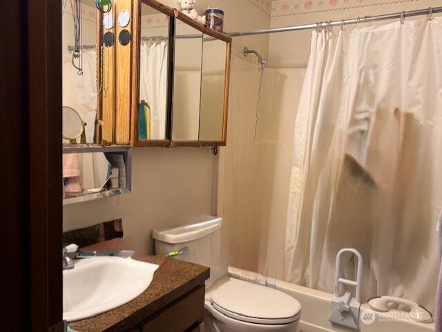 1 Lake Louise Drive, Unit 42 Bellingham, WA 98229 - Photo 9 of 21 a bathroom with a sink a toilet and shower curtain