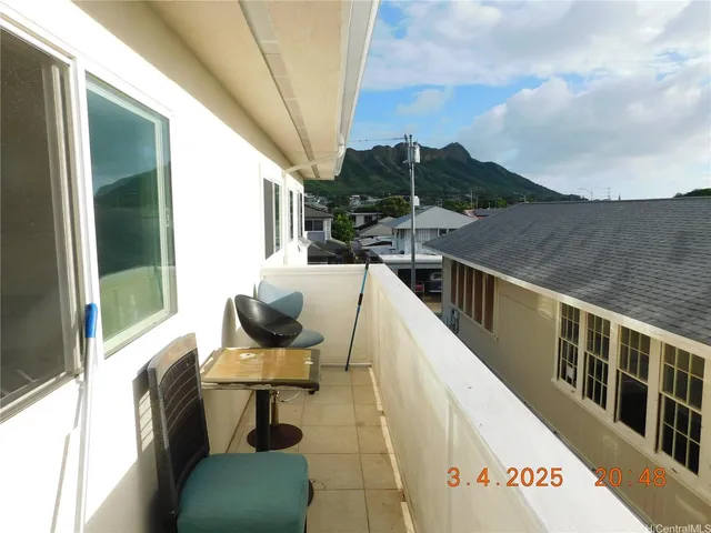 a view of balcony with furniture