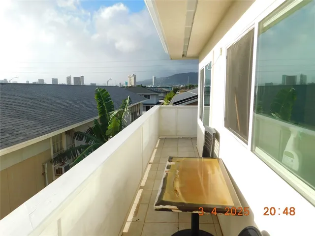 a view of balcony with furniture
