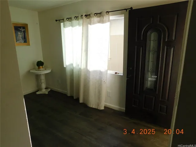 a bathroom with a tub sink and glass door