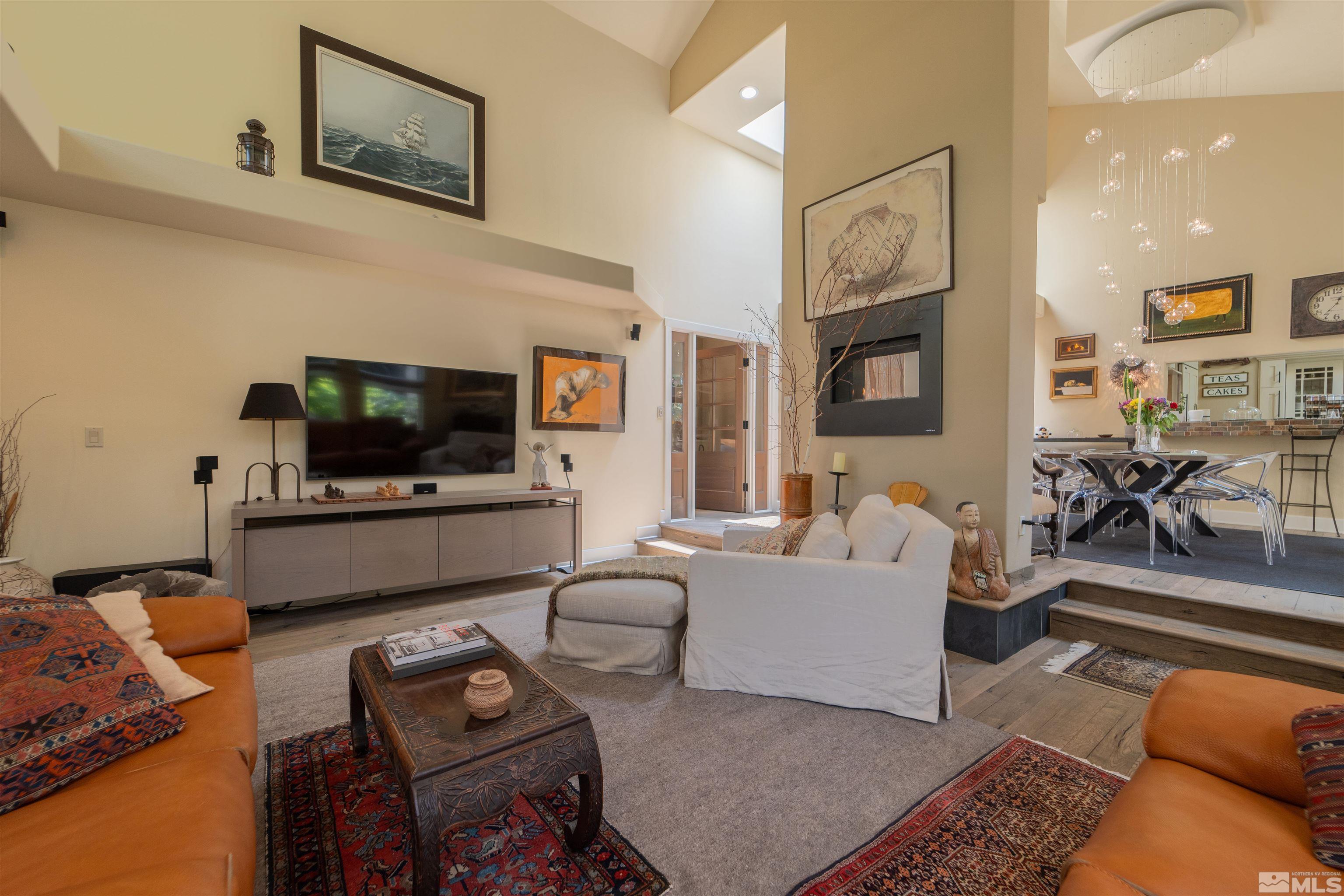 3925 Caughlin Creek Road Reno, NV 89519 - Photo 3 of 38 a living room with furniture and a flat screen tv