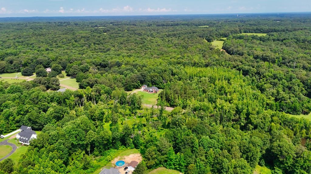 1 Oakview Loop Bolivar, TN 38008 - Photo 12 of 17 a view of a lush green forest with trees and some houses