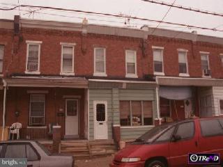 873 North 66th Street Philadelphia, PA 19151 - Photo 1 of 1 a view of a building with car parked