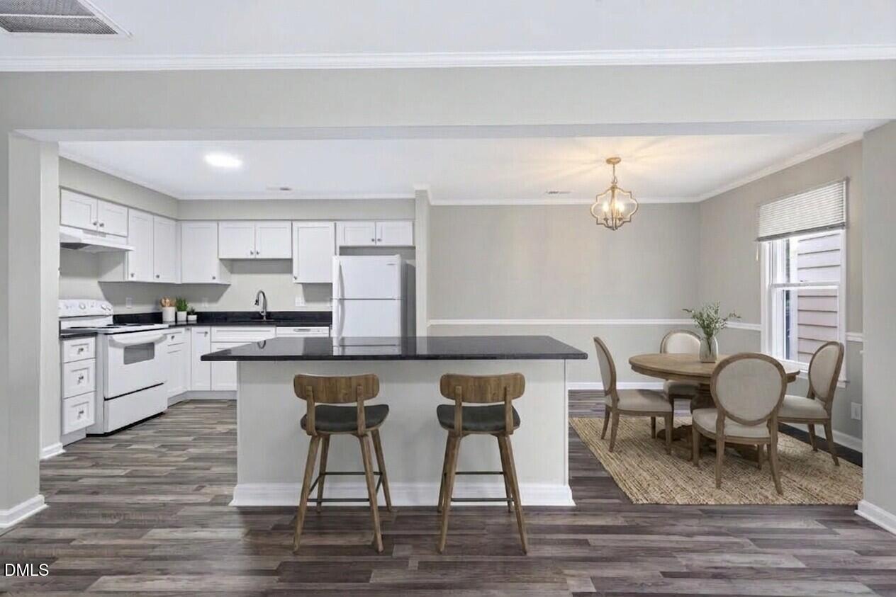 708 Powell Drive, Unit A Raleigh, NC 27606 - Photo 2 of 20 Virtually staged kitchen and dining room areas