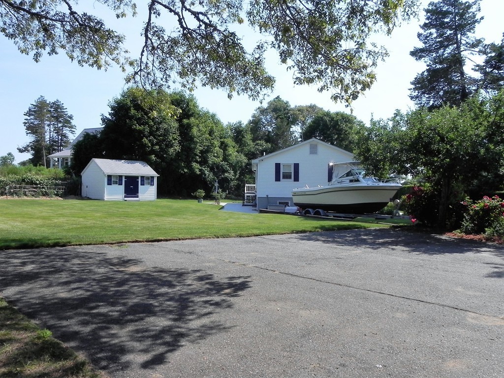 5 Brom Dutcher Road Bourne, MA 02532 - Photo 23 of 27 a view of a house with backyard and garden