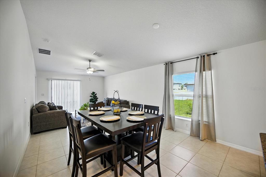 73 Rain Lily Ave Spring Hill Spring Hill, FL 34609 - Photo 11 of 37 a dining room with furniture and window