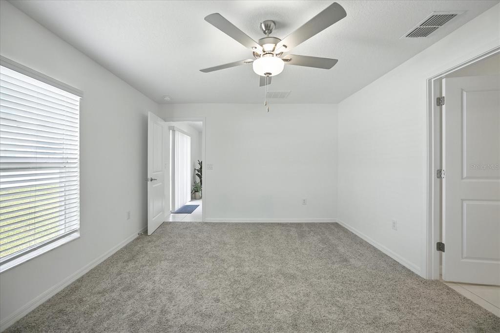 73 Rain Lily Ave Spring Hill Spring Hill, FL 34609 - Photo 16 of 37 a view of an empty room with a window