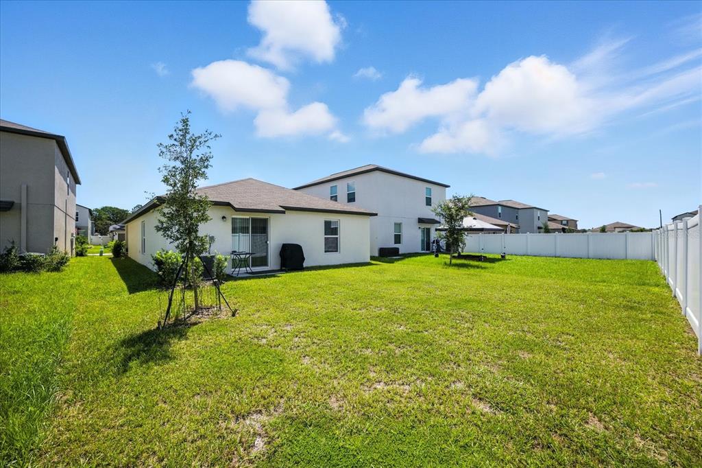 73 Rain Lily Ave Spring Hill Spring Hill, FL 34609 - Photo 30 of 37 a house view with a garden space