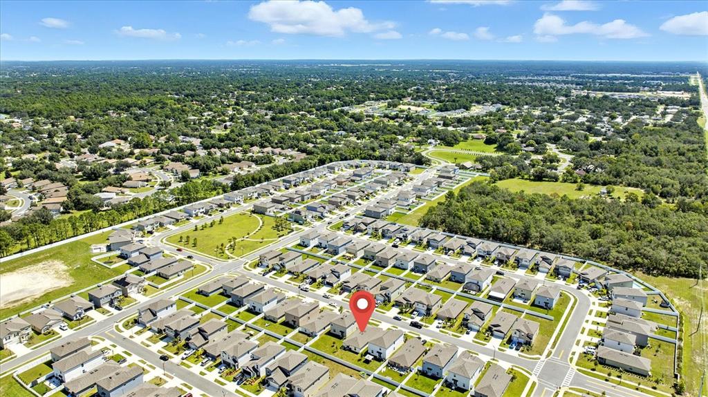 73 Rain Lily Ave Spring Hill Spring Hill, FL 34609 - Photo 33 of 37 an aerial view of residential houses with outdoor space