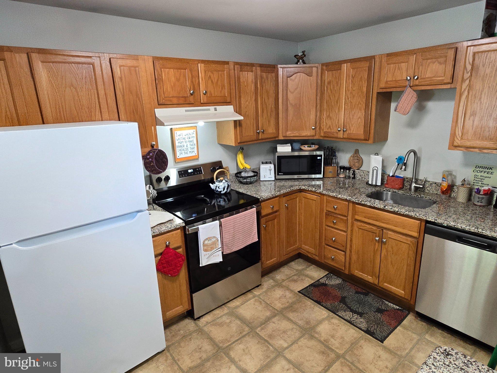 178 Elephant Road, Unit B13 Dublin, PA 18917 - Photo 6 of 21 Cozy kitchen with warm wood tones.