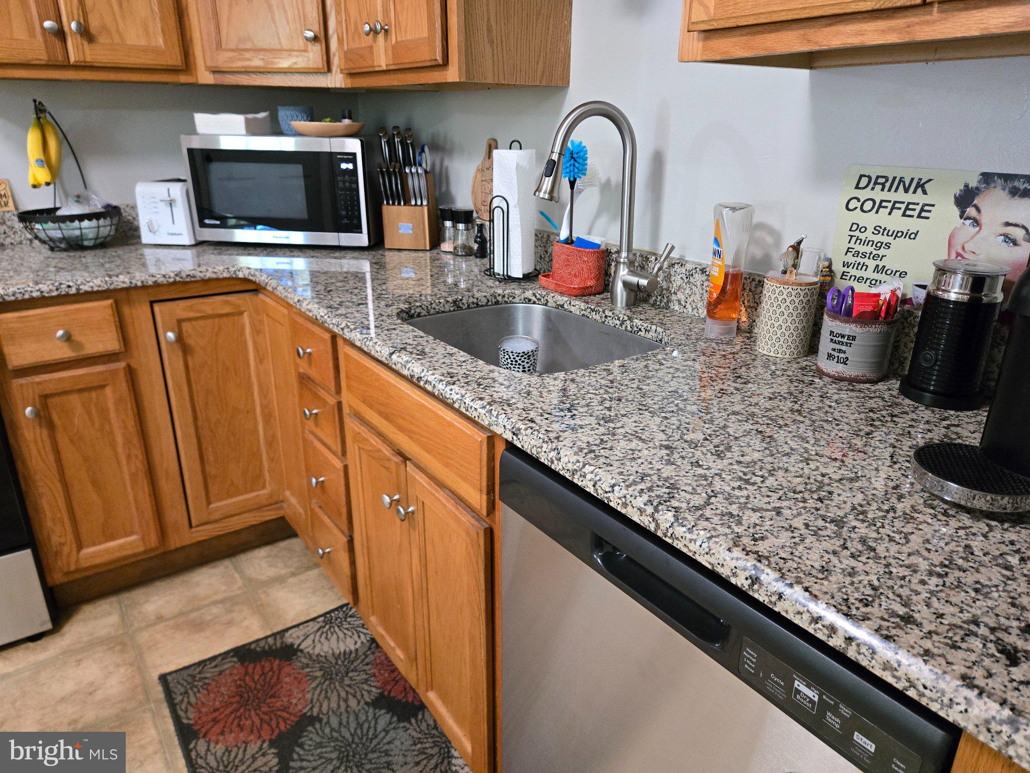 178 Elephant Road, Unit B13 Dublin, PA 18917 - Photo 7 of 21 Modern kitchen with granite elegance.