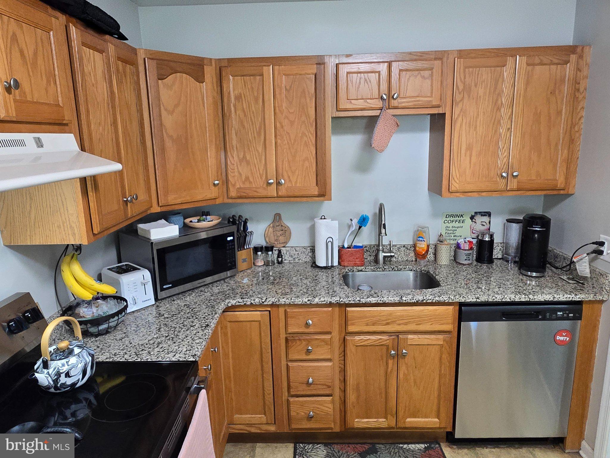 178 Elephant Road, Unit B13 Dublin, PA 18917 - Photo 9 of 21 Cozy kitchen with warm wood accents.