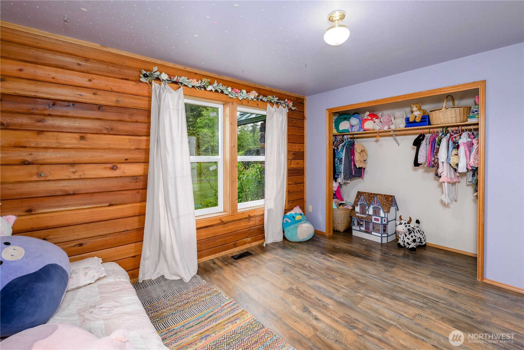 134 Bishop Road Port Angeles, WA 98363 - Photo 18 of 38 a view of a room with gym equipment and wooden floor
