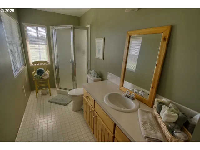 a bathroom with a sink a mirror and a toilet