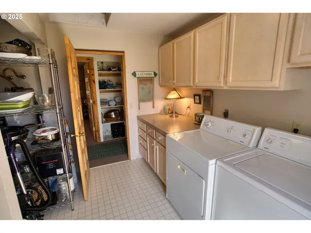 a kitchen with stainless steel appliances a sink stove and cabinets