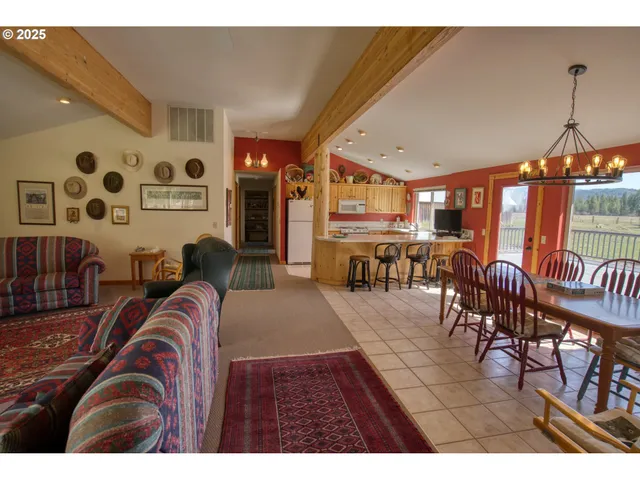 a bedroom with a bed window and dresser