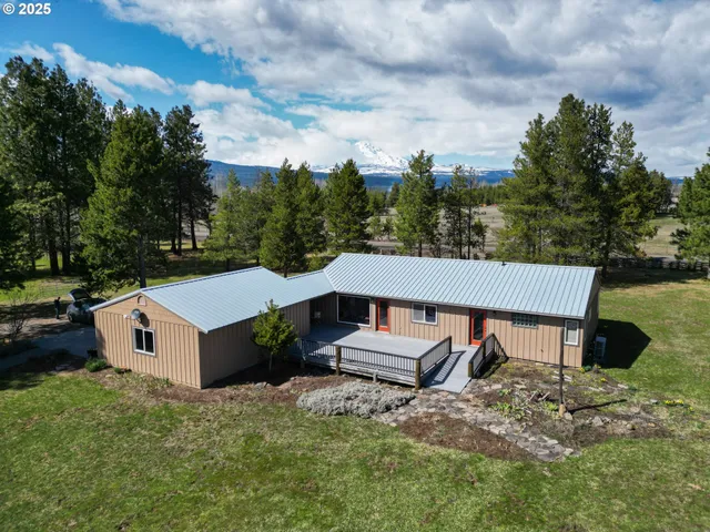 a kitchen with stainless steel appliances granite countertop a stove a sink dishwasher and a refrigerator