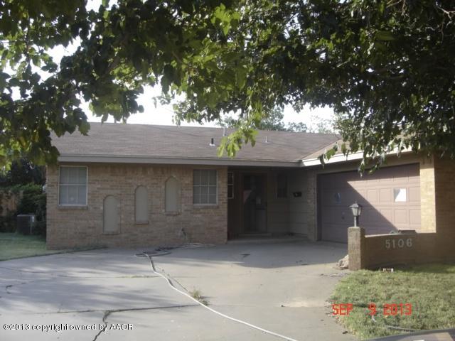 5106 Shield Drive Amarillo, TX 79110 - Photo 3 of 13 a front view of a house with a yard