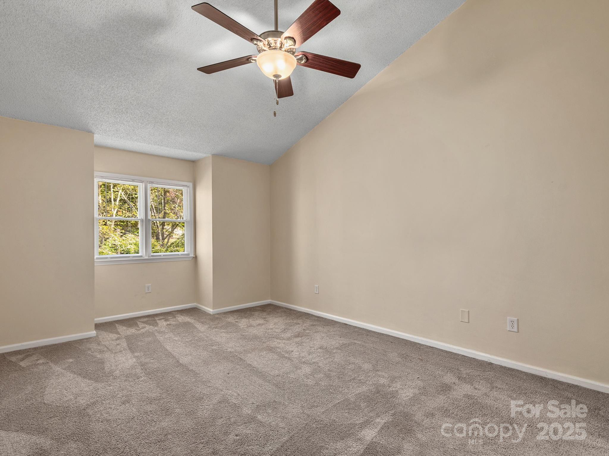 8 Willow Tree Run, Unit 8 Asheville, NC 28803 - Photo 11 of 19 an empty room with windows and fan