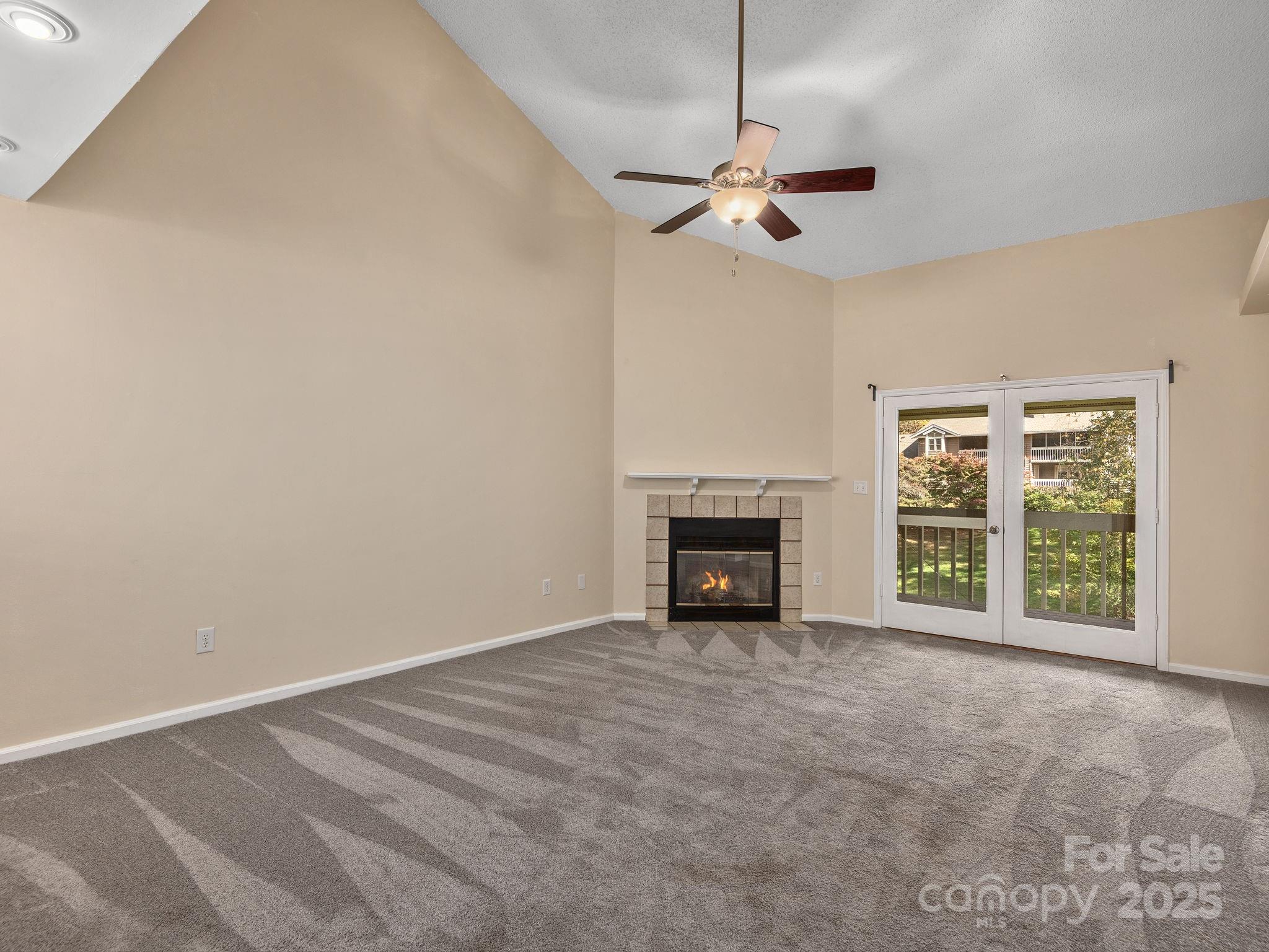 8 Willow Tree Run, Unit 8 Asheville, NC 28803 - Photo 4 of 19 a view of an empty room with a fireplace and a window
