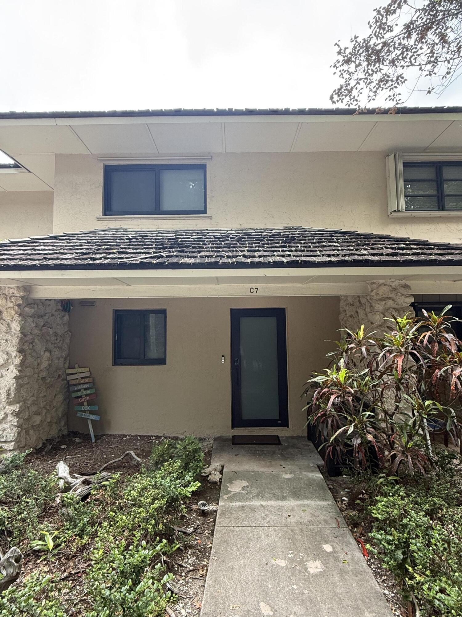 96000 Overseas Highway, Unit C7 Key Largo, FL 33037 - Photo 1 of 14 a front view of a house