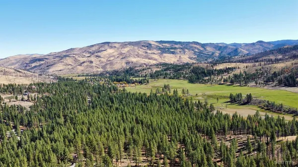 a view of a large body of water with a building in the background