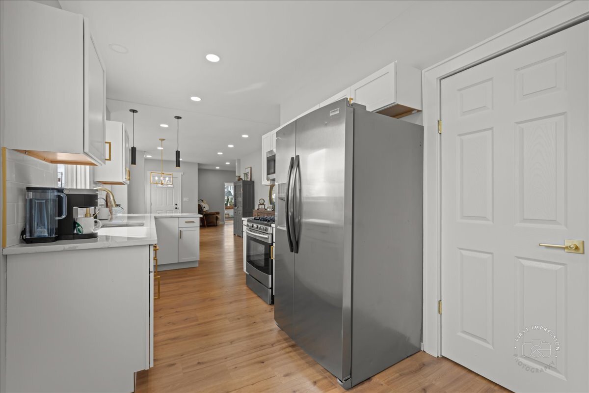 20 Central Avenue Aurora, IL 60506 - Photo 12 of 22 a kitchen with stainless steel appliances a refrigerator and a stove top oven